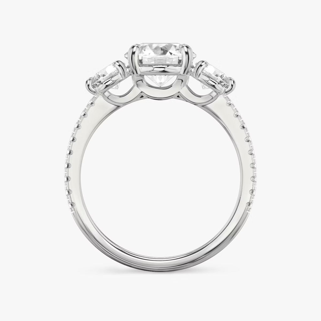 The Three Stone Round Brilliant with Round Side Stones Pave Engagement Ring