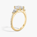 The Three Stone Oval with Pear Side Stones Pave Engagement Ring