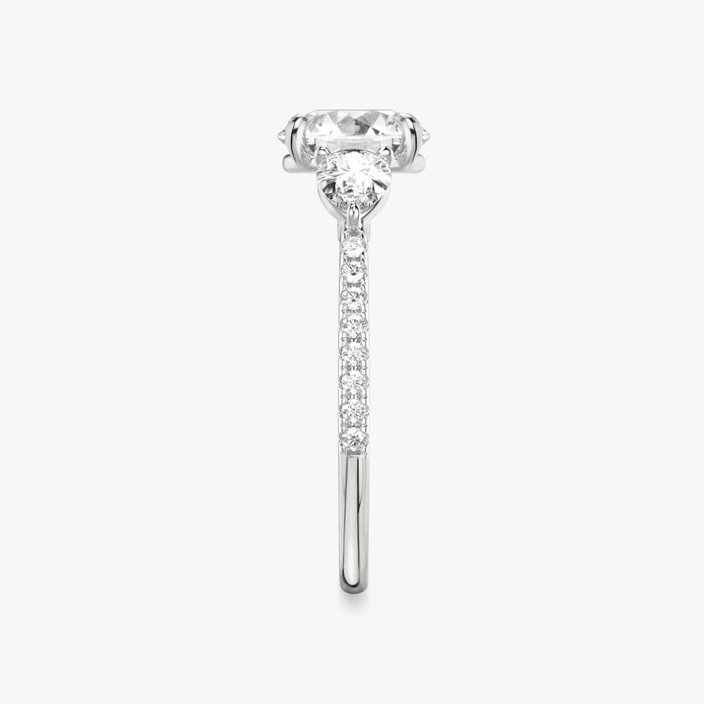 The Three Stone Round Brilliant with Pear Side Stones Pave Engagement Ring