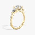 The Three Stone Round Brilliant with Pear Side Stones Pave Engagement Ring