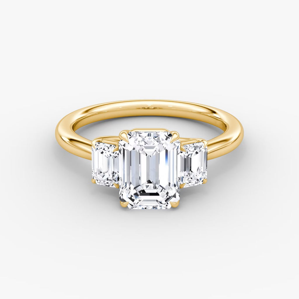 The Erelis Three Stone Emerald Engagement Ring