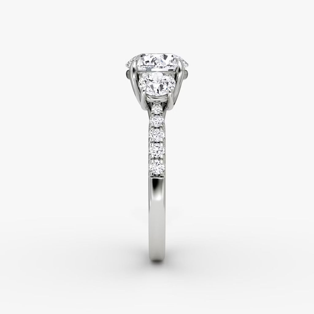 The Erelis Three Stone Round Brilliant Pave Engagement Ring